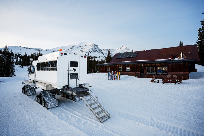 Eleven snow cat outside of cat ski barn in CO