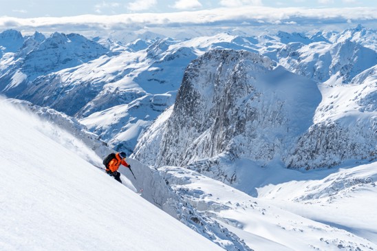 A person skiing downhill in a Chilean mountain range.
