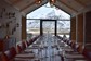 A large dining table in Deplar Farm with views of Icelandic Mountains