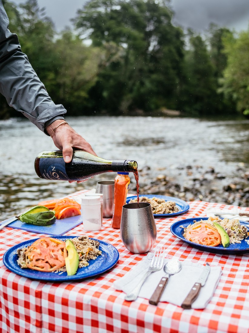 Fresh made lunch and wine being served river side.