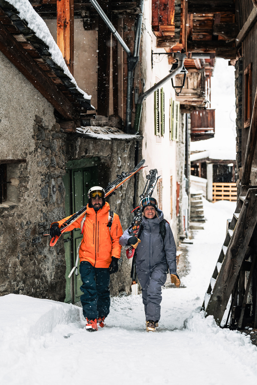 Skiers return to a French village in the Alps.