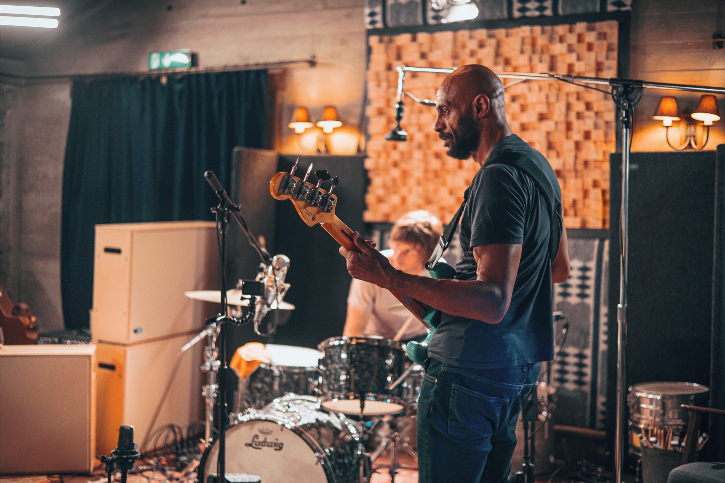 A bass player and drummer during a live recording session at Floki.