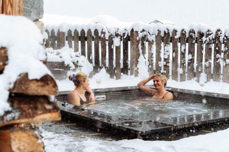 Back at the chalet, enjoy the scenery and a nightcap from the terrace hot tub