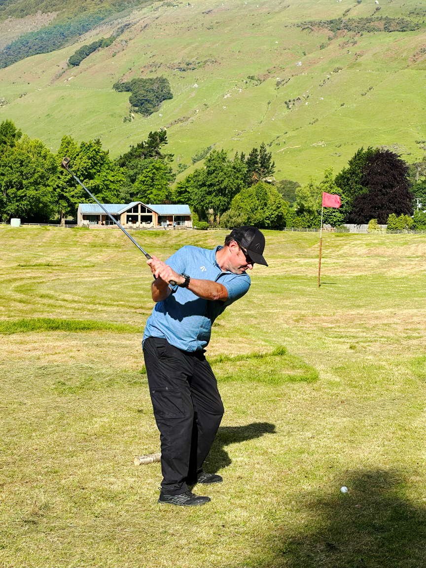 Man golfing at Cedar Lodge