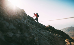 Man climbing mountain